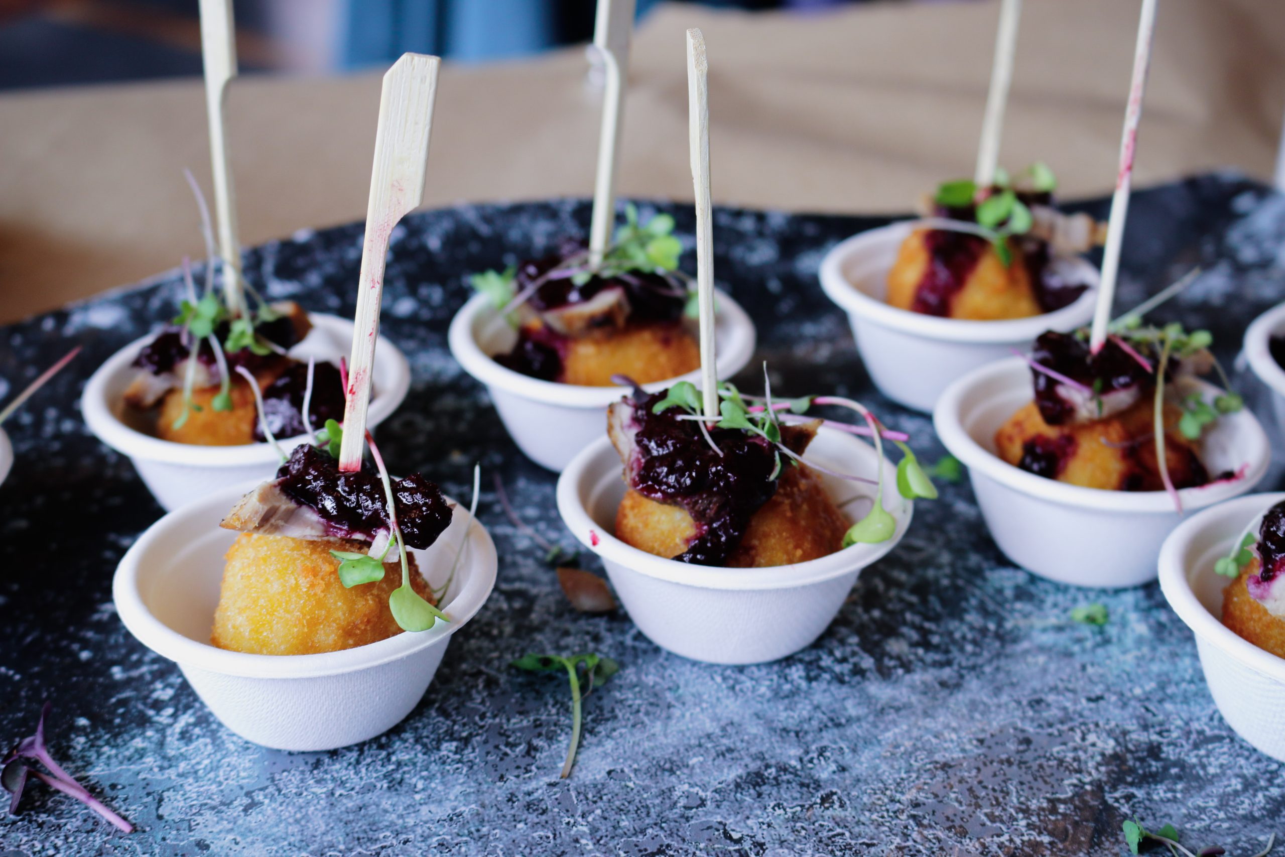 Smoked Eola Hills pork loin with rosemary arancini, spring cherry sugo