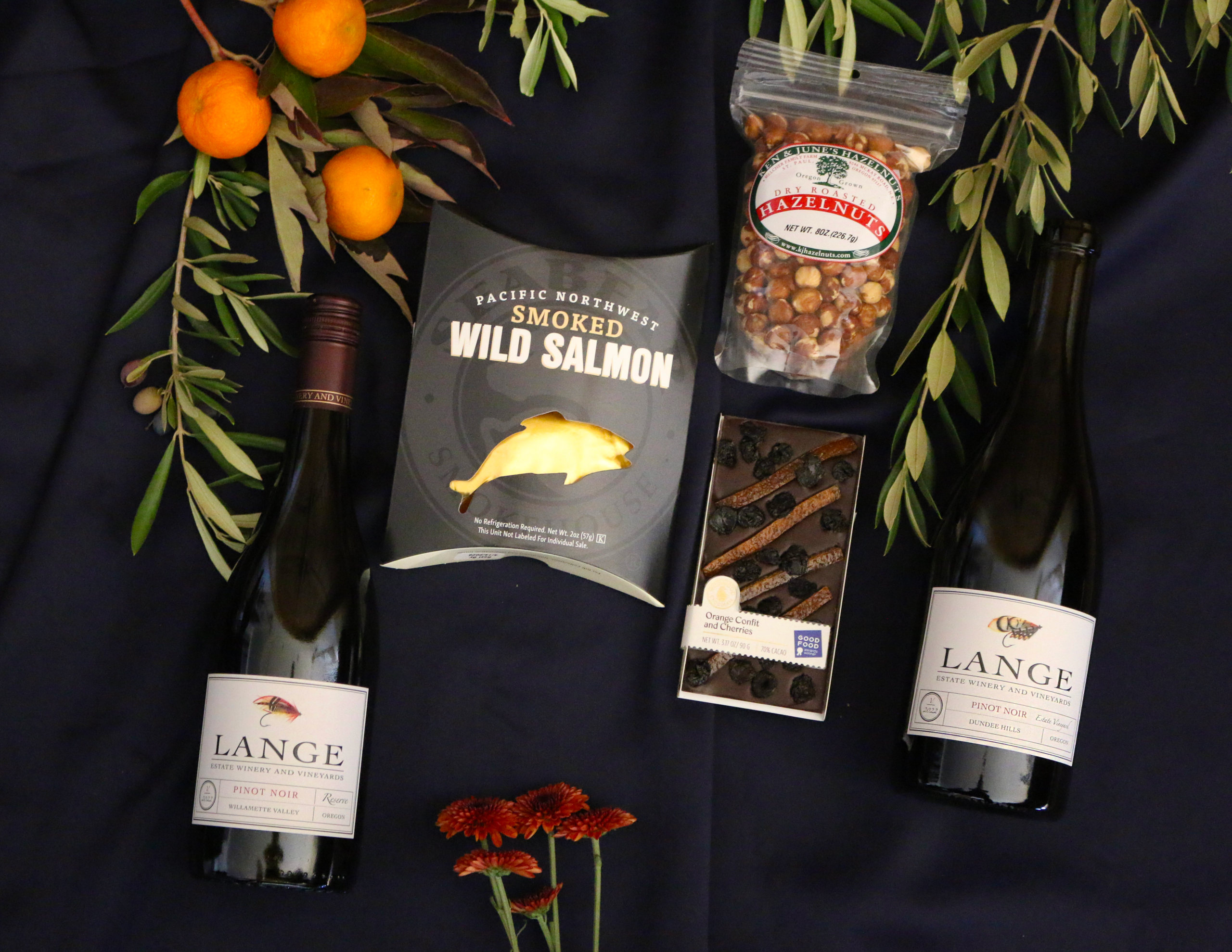 PNW Delights Bundle with Pinot Noir Reserve, Estate Pinot Noir, Hazelnuts, Chocolate bar and smoked salmon.